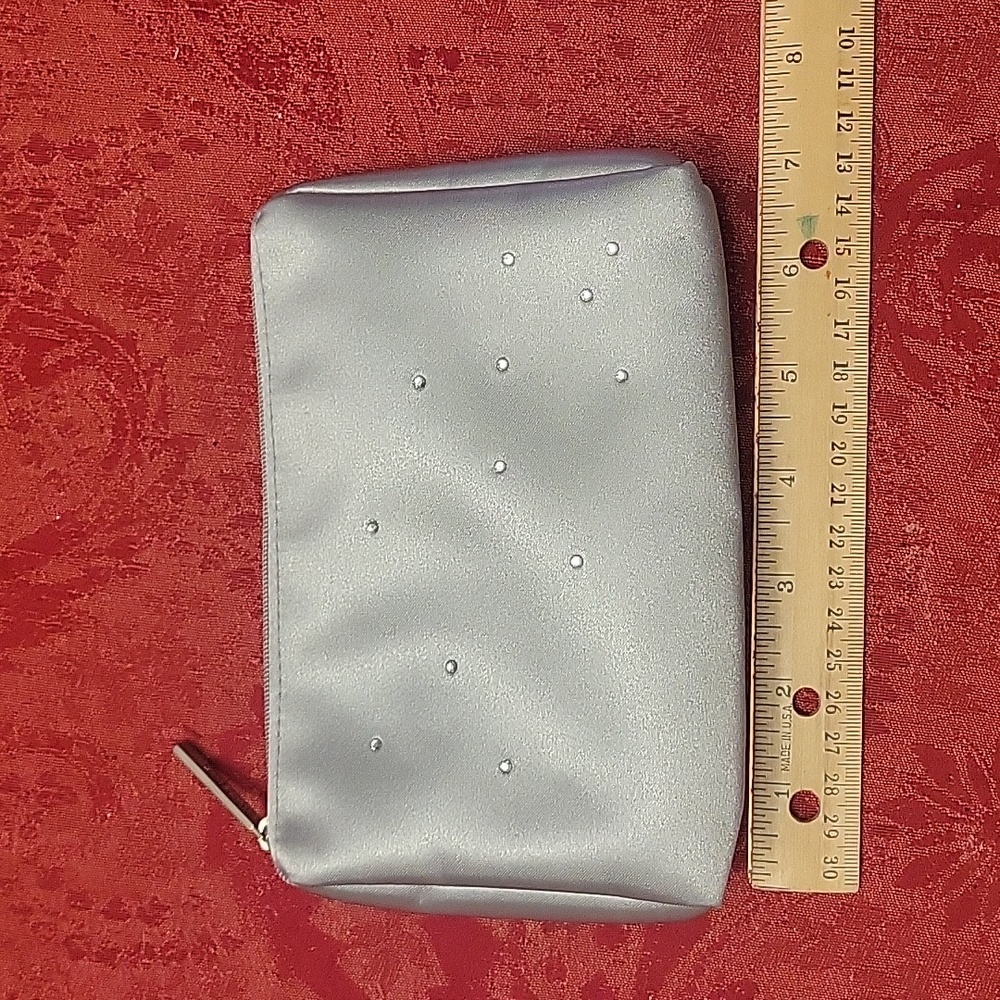 Silver Bath and Body Works makeup bag